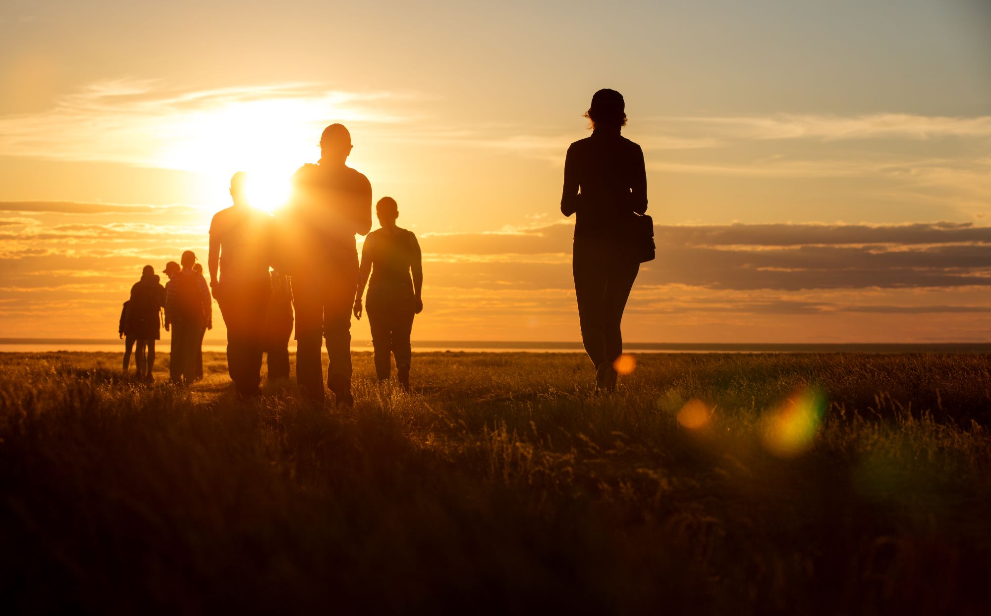 A group of hikers at sunset.