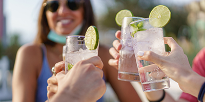 Women holding drinks.